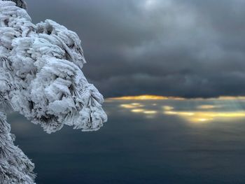 Scenic view of snow against sky during sunset