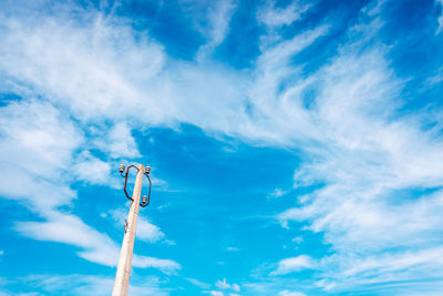 Low angle view of street light against sky