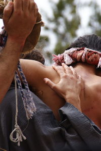 Close-up of people holding hands