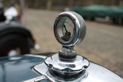 Close-up of vintage car on street