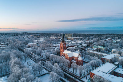 High angle view of buildings in city against sky during winter