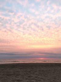 Scenic view of sea against sky at sunset