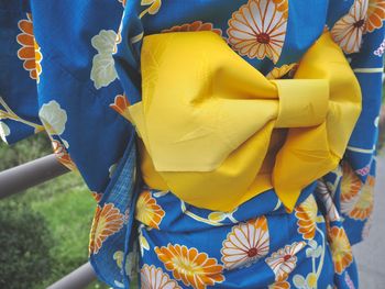 Midsection of woman wearing traditional clothing