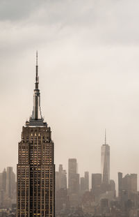 Buildings in city against sky