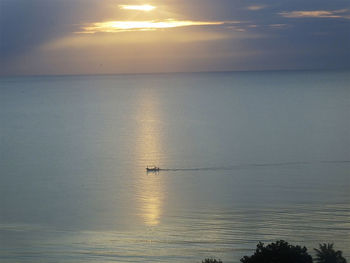 Scenic view of sea against sky at sunset