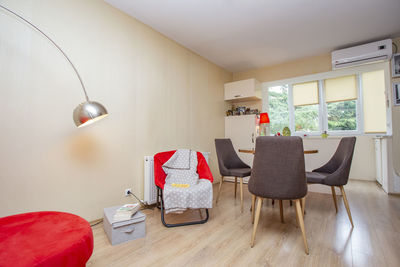 Table and chairs on hardwood floor at home