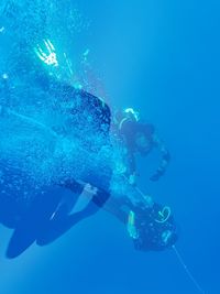 People swimming in sea