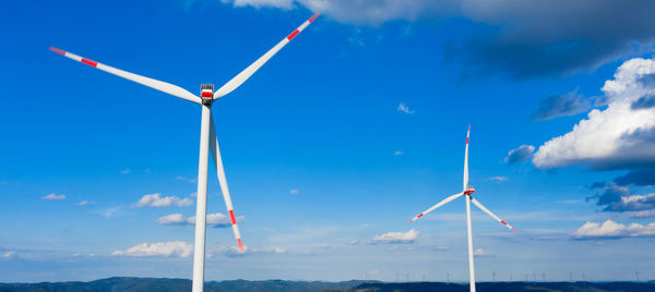 Low angle view of windmill against sky