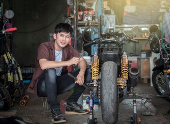 Portrait of smiling young man sitting in bus