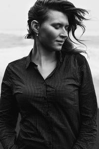 Close up pretty tourist on sea beach outdoor monochrome portrait picture