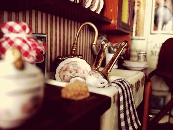 Close-up of mannequin on table at home