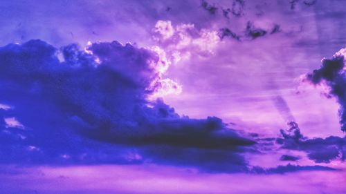 Low angle view of clouds in sky at sunset