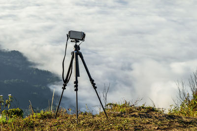 Low angle view of camera against sky