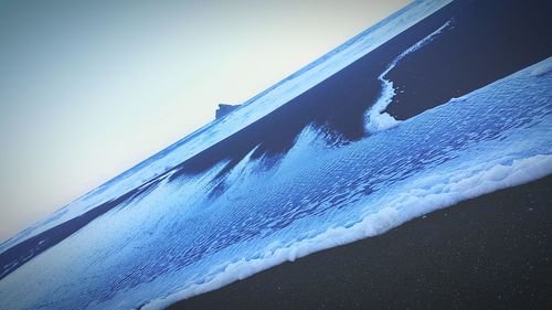 Close-up of water against blue sky