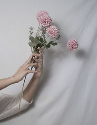 Midsection of woman holding bouquet