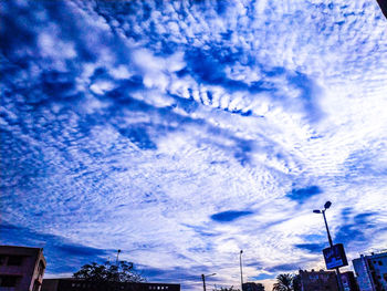 Low angle view of buildings in city against sky