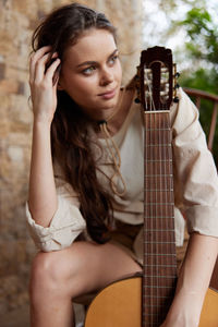 Young woman playing guitar