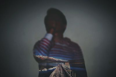 Man standing in front of built structure