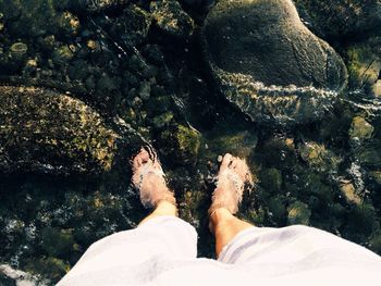 Low section of woman in water
