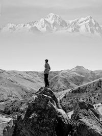 Man standing on snowcapped mountain