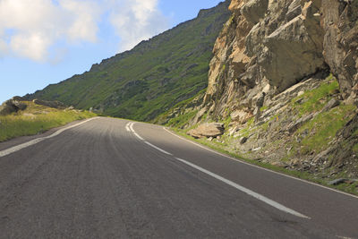 Surface level of road against mountain range