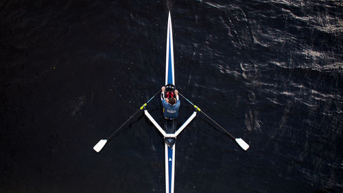 High angle view of illuminated pole by sea