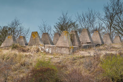 Old ruin on field against sky