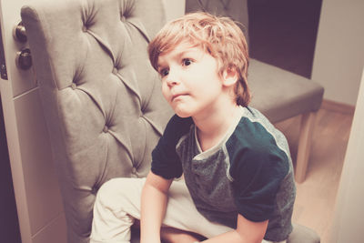 Boy sitting at home