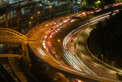 High angle view of light trails on road at night