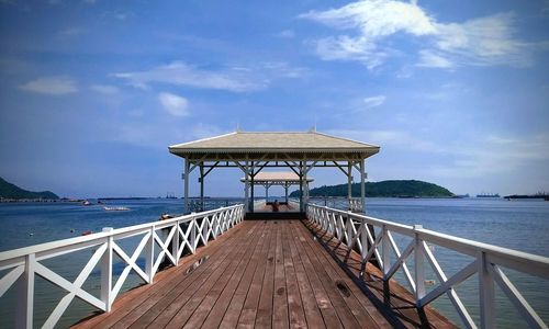 Pier over sea against sky