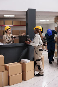 Rear view of man working at home