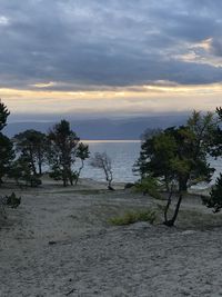 Scenic view of beach against sky during sunset