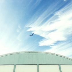 Low angle view of airplane flying in sky