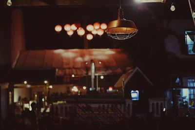 Illuminated lanterns hanging in restaurant