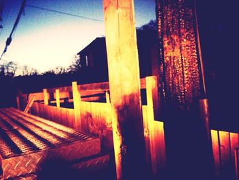 Low angle view of built structure at sunset