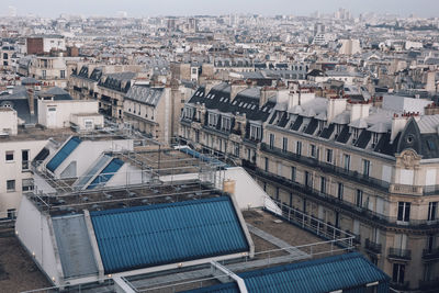 High angle view of buildings in city against sky