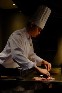 Chef preparing food in restaurant