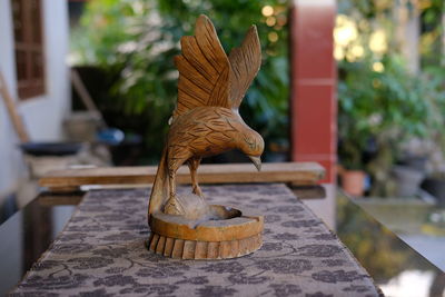 Close-up of statue on table