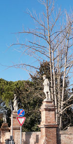 Low angle view of statue against clear blue sky