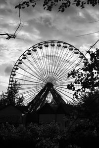 Low angle view of ferris wheel against sky