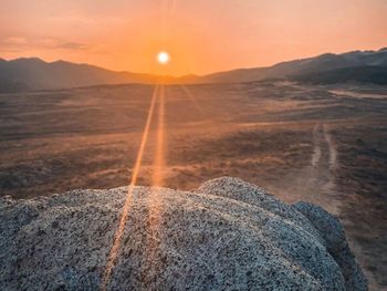 Scenic view of landscape against sky during sunset