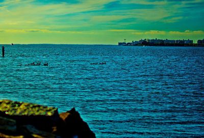 View of calm sea against cloudy sky