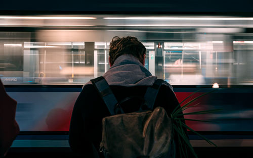 Rear view of man in train