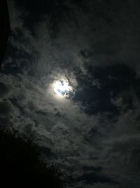 Low angle view of silhouette moon against sky at night