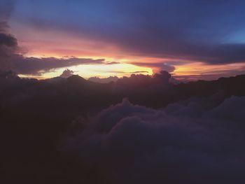 Scenic view of mountains against sky at sunset