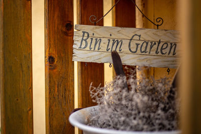 Close-up of text on wooden door