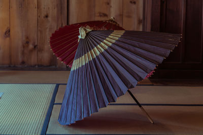 Close-up of multi colored umbrella on wooden table