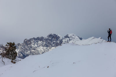 Scenic view of snowcapped mountain against sky during winter