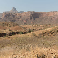 Scenic view of desert landscape against clear sky