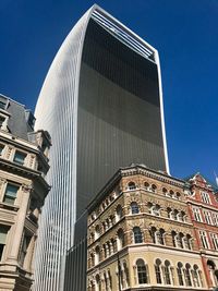 Low angle view of building against blue sky